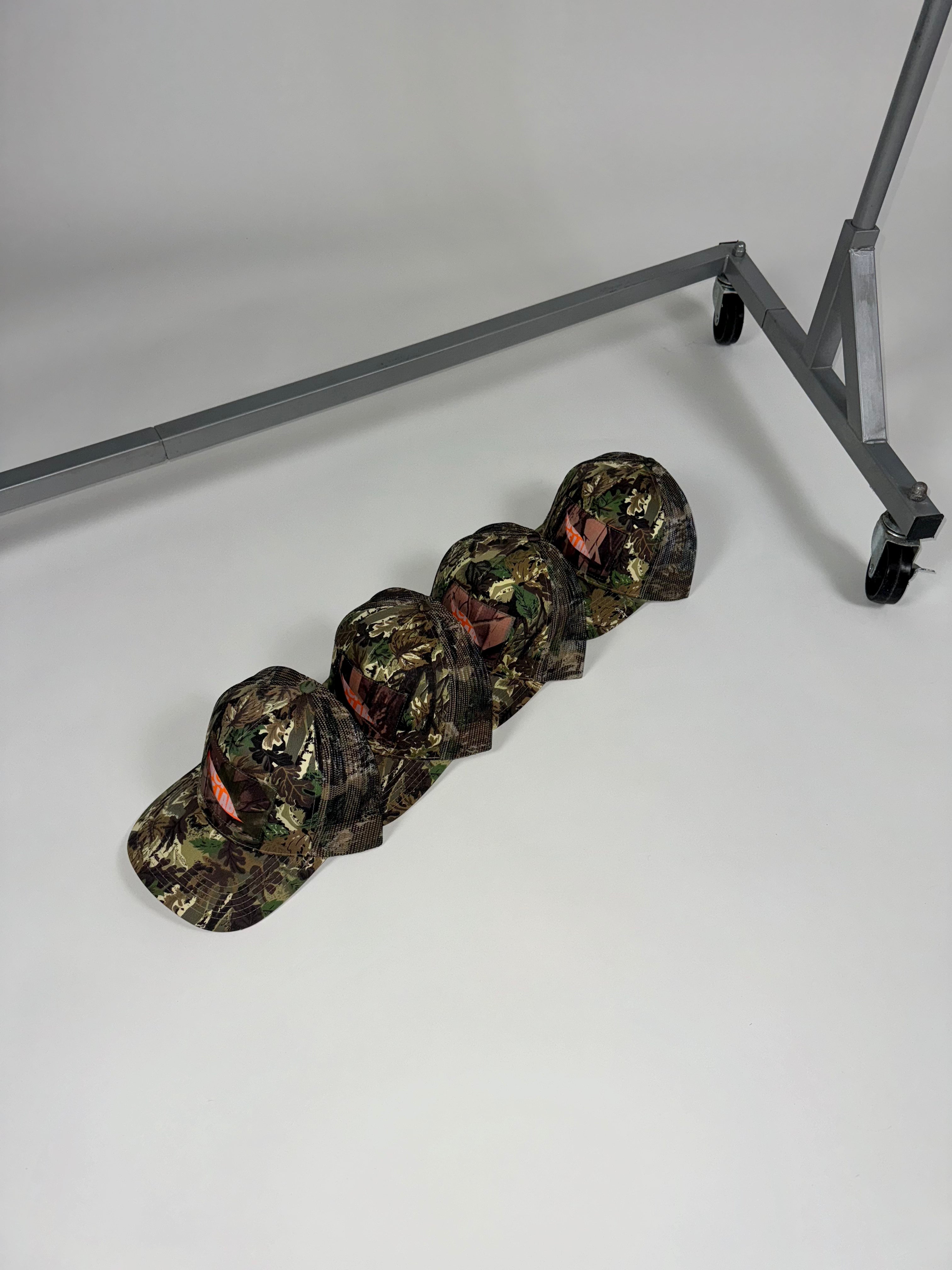 IN-STOCK | PEEK-A-BOO CAMO TRUCKER HAT