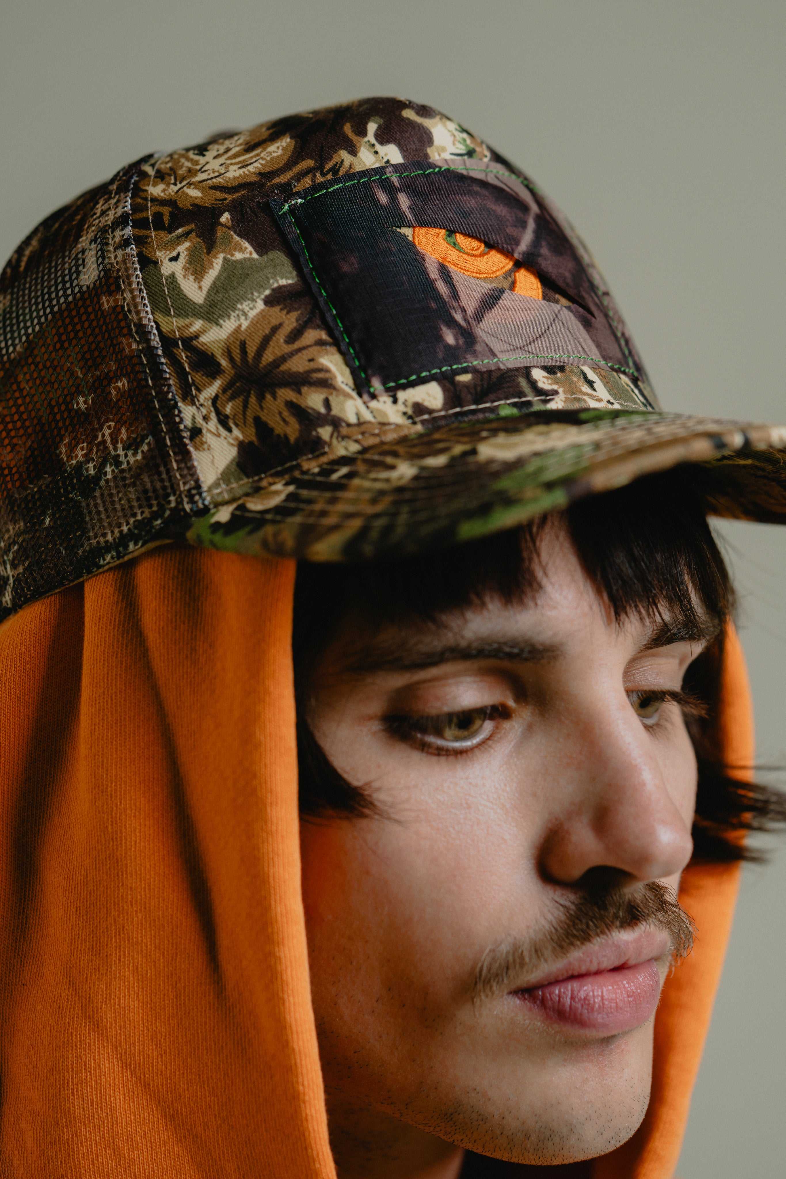 IN-STOCK | PEEK-A-BOO CAMO TRUCKER HAT